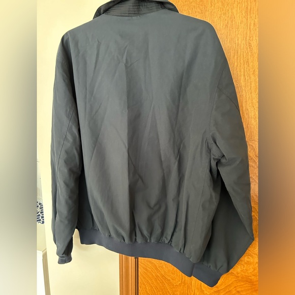 WP100 Men’s black golf jacket. Snap pockets weatherproof - Picture 2 of 5